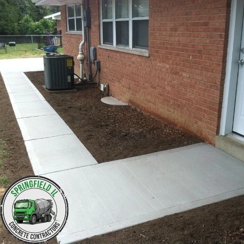 New concrete sidewalk installed in a Springfield residential area.